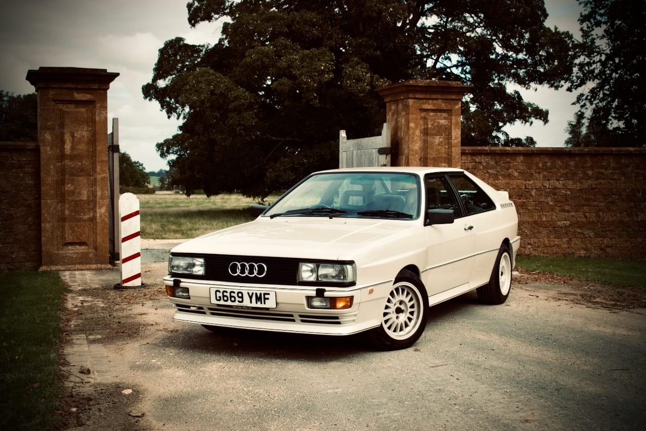 Quattro in front of gate, retro